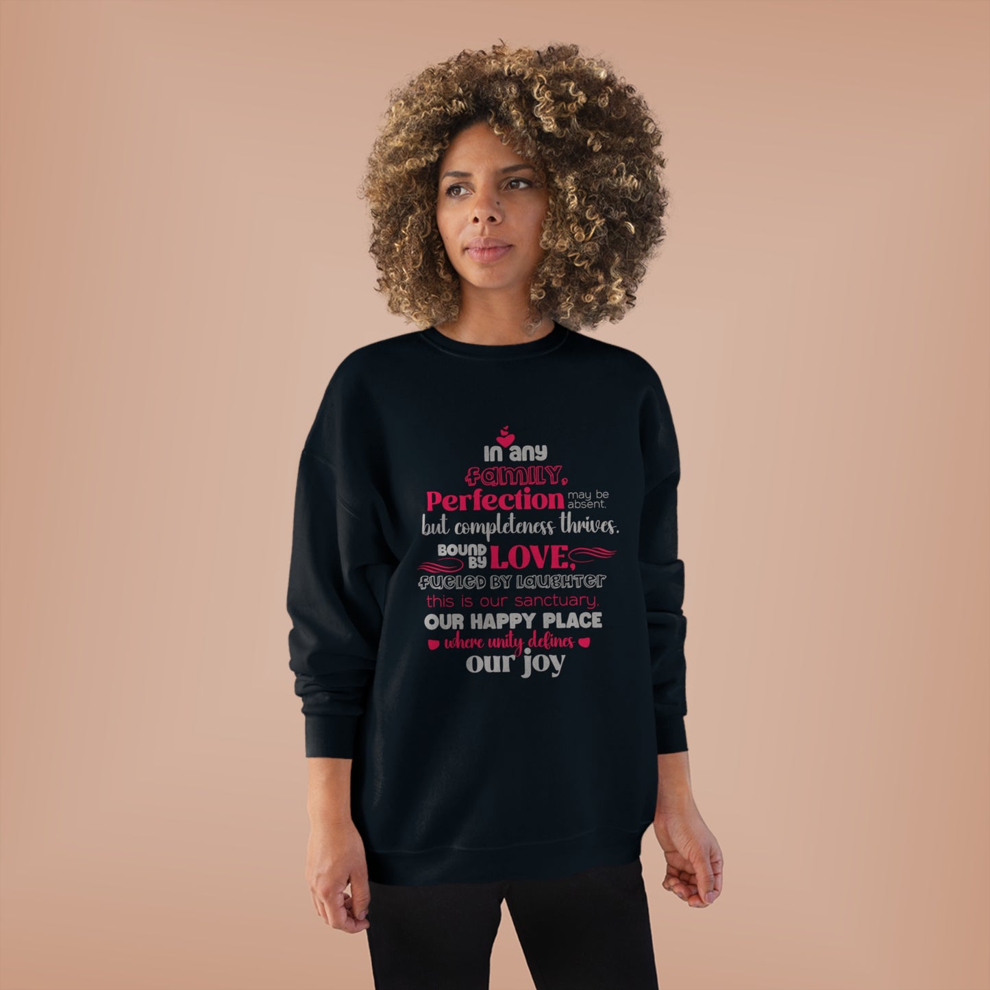 Female model wearing Complete Comfort - Unisex EcoSmart® Crewneck Sweatshirt in Black with typography design reflecting the quote 'In Any family, perfection may be absent, but completeness thrives. Bound by love, fueled by laughter – this is our sanctuary