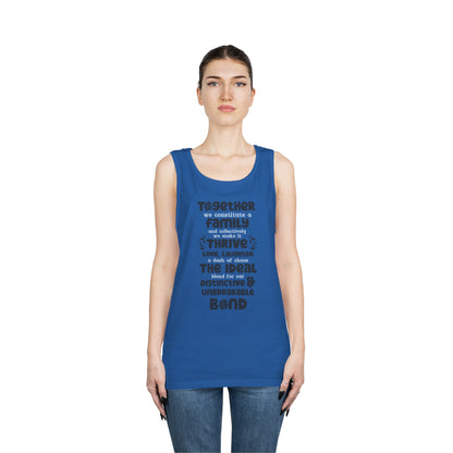 Front View On The Female Model In True Royal Color of the "Thriving Unity - Unisex Heavy Cotton Tank Top featuring a typographic design with the quote "Together, we constitute a family, and collectively, we make it thrive. Love, laughter, and a dash of ch