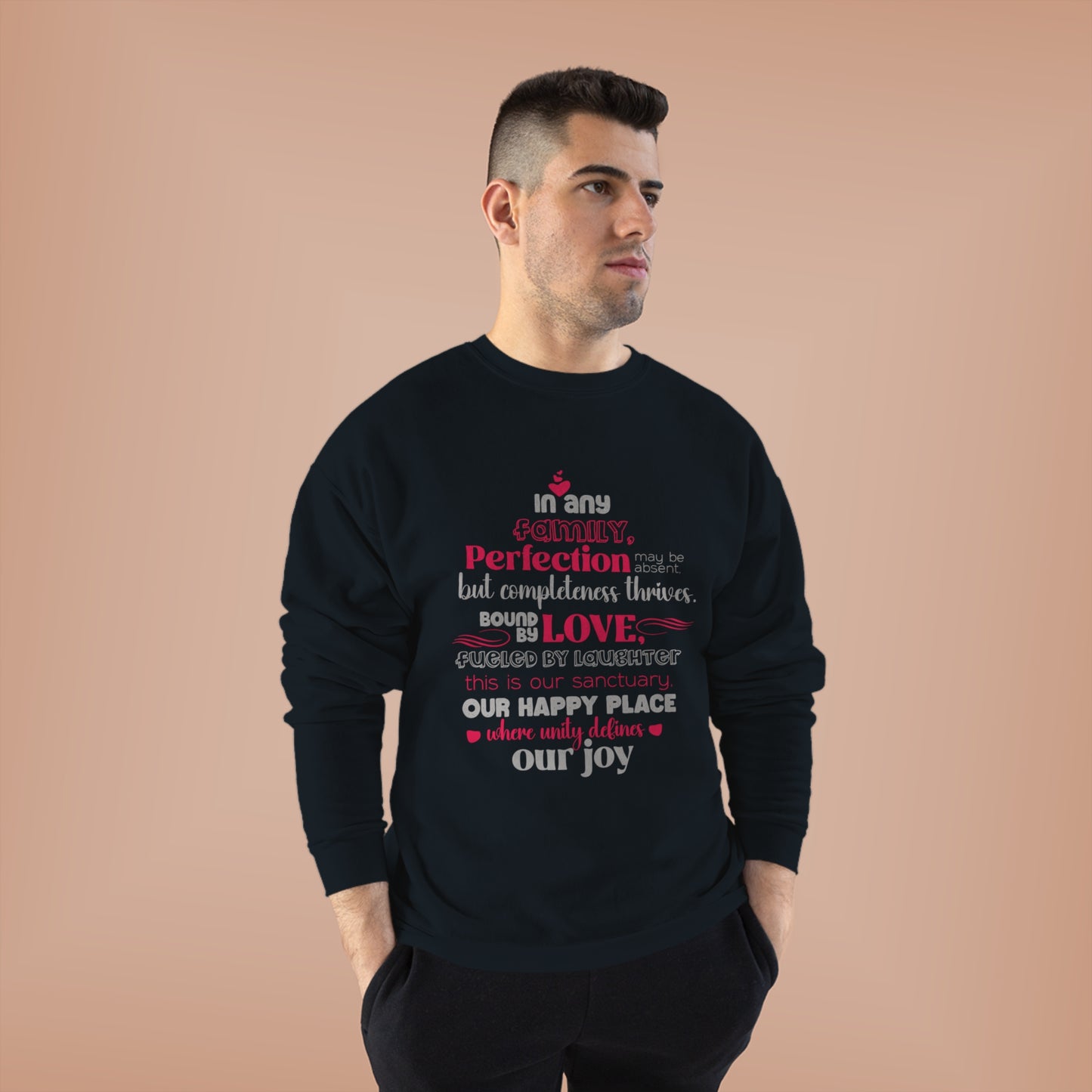 Male model showcasing Complete Comfort - Unisex EcoSmart® Crewneck Sweatshirt in Black with typography design inspired by the quote 'In Any family, perfection may be absent, but completeness thrives. Bound by love, fueled by laughter – this is our sanctua